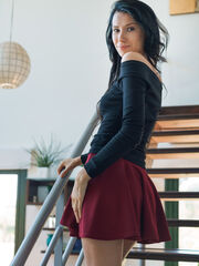 Alecto's black top, brownish-red skirt and black nylons adds secret and temptingness to her erotic delight