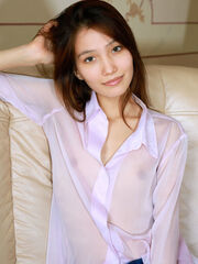 Anna Aki tease her long sleeves and denim on the couch exposing her slim body