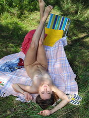 Ava shows her beguiling body and hot pussy in the park