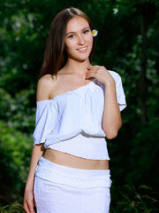 Like a muse or woodland nymph, Belonika's beautiful princess, ravishing smile, and young body strips out in the verdant surround