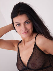 Astonished debutante Ely stripping in her sheer black top, black bikini, and nice-fitting thigh high nylons