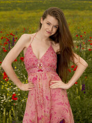Emily Bloom's pretty smile and young body sticks out in a field of blossoms