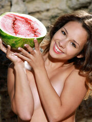 Emmy provocativly poses with a watermelon on her lovely body