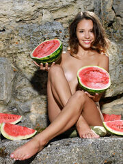 Emmy provocativly poses with a watermelon on her lovely body