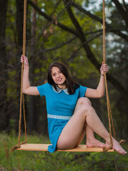 Hilary C magnificently poses outdoors having fun with her well-made body on the swing