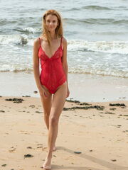 First timer Ingrid gets off her red bikini as she uncover her beautiful figure on the sand