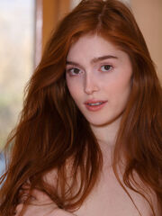 Jia Lissa flashes her smooth body as she strips with her leather straps