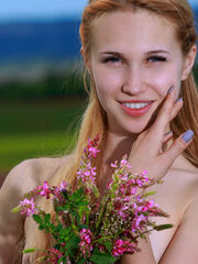 Kendell strips among the blossoms having fun with her sweety, impressing body