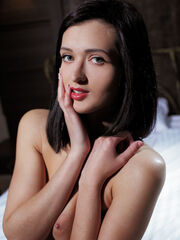 Lara D share off her impressive body as she sultrily poses on the bed