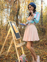 Suzanna A flaunts off her delightful figure as she bares her paiting abilities in the forest