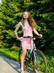 Vittoria A demonstrates her charming body as she bares by the bike