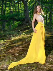 Vivian strips her long, yellow dress exposing her healthy body and tight vagina in the park